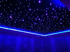 the ceiling is lit up with blue lights