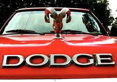 an old dodge truck with the word dodge written on it's hood and ram horns