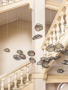 an image of a staircase with glass balls hanging from it