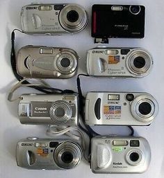 many different types of digital cameras on display