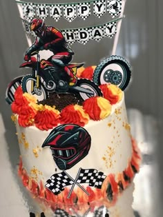 a motorcycle themed birthday cake on a table