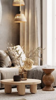 a living room filled with furniture and flowers in vases on top of the coffee table