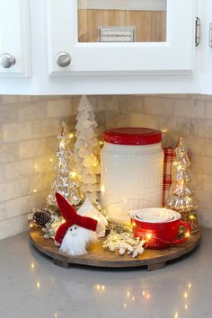 a kitchen counter with christmas decorations on it