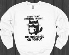 For those who prefer to be left alone in the morning: This funny sweatshirt featuring the 'I Don't Like Morning People' cat design is just what you need. Made from soft, cozy fabric, it's perfect for those quiet morning moments with your coffee - alone, of course! A great gift for morning haters and cat lovers who enjoy their solitude. Whether as a Christmas gift, birthday present, or just to make your point, this sweatshirt says it all! * 50% cotton, 50% polyester * Pre-shrunk * Classic fit * 1 Funny Morning, Quiet Morning, Morning People, People Funny, Cat Sweater, Funny Sweaters, Cozy Fabric, Funny Sweatshirts, Funny Coffee