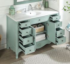 a bathroom vanity with drawers and a mirror