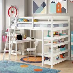 a white loft bed with desk underneath it in a child's bedroom or playroom