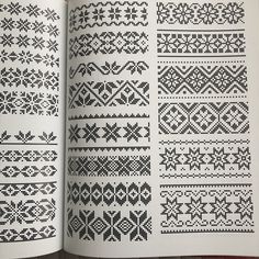 an open book with black and white knitting patterns on it's pages, showing different designs