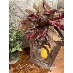 a lantern with a candle in it sitting on a table