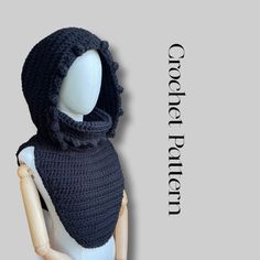 a mannequin wearing a black crocheted scarf and hat with text overlay