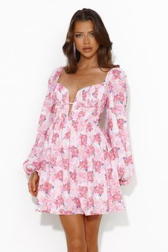 Length from bust to hem of size S: 63cm. Chest: 36cm, Waist: 30cm, size S. Mini dress. Semi-lined. Model is a standard XS and is wearing size XS. True to size. Non-stretch. Elastic details. V-neck. Puff sleeves. Flowy skirt. Zipper. Cold hand wash only. Polyester/Rayon. A special look for a special gal like you. The Expressing Fun Long Sleeve Mini Dress features a sultry V-neck and long puff sleeves. Style with heels for a party or sandals for brunch. Pink Flowy Dress Long, Flowy Dress Long Sleeve, Pink Flowy Dress, Floral Pink Dress, Flowy Dress Long, Mini Dress Pink, Flowy Mini Dress, Skirt Zipper, Sleeves Style