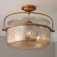 a light fixture hanging from the ceiling in a room