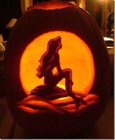 a pumpkin carved to look like a mermaid