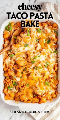 cheesy taco pasta bake in a white casserole dish