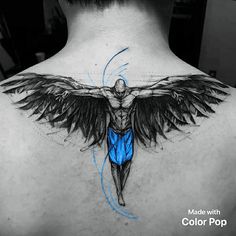 the back of a man's neck with an angel tattoo on it