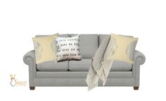 a gray couch with two pillows on it