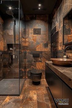 a modern bathroom with stone walls and flooring