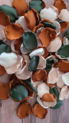 some brown and white flowers on a wooden surface