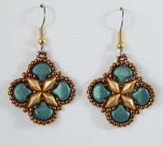 a pair of earrings with gold and blue beads