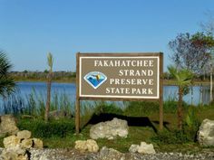 there is a sign that says fakahatche strand preserve state park