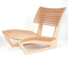 a wooden chair and foot stool made out of plywood wood, on a white background