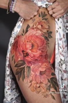 a woman's stomach with flowers on it