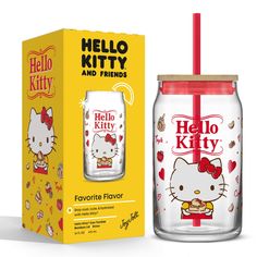 a hello kitty glass cup with straw and lid next to a box for the drink