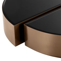 a black and gold coffee table with two sections