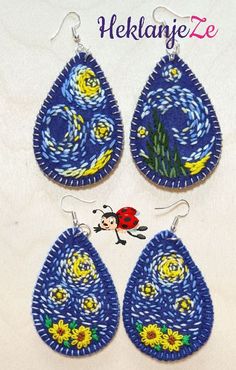 three pieces of blue fabric with yellow flowers and ladybug in the sky on them