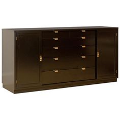 a large brown cabinet with gold handles and drawers on the bottom, against a white background