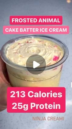 a person holding up a cup of cake batter ice cream with the text, frosted animal cake batter ice cream calories 25g protein