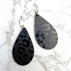 Laser cut black in black leopard acrylic earrings surgical steel, hypoallergenic nickel and lead free approximaty 2.5” handmade by me Trendy Black Nickel-free Earrings, Black Edgy Dangle Earrings, Edgy Black Dangle Earrings, Edgy Black Earrings For Gift, Edgy Black Hypoallergenic Jewelry, Black Enamel Metal Earrings, Black Edgy Earrings, Black Hypoallergenic Adjustable Earrings, Edgy Black Adjustable Earrings