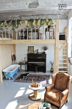 a living room filled with furniture and a piano