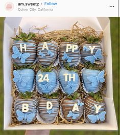 a box filled with chocolate covered strawberries in the shape of hearts and butterflies on top of each other