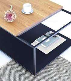 a coffee table with glasses on it and a flower in the middle next to it