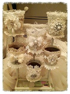 an arrangement of lace and flowers on display