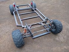 an off - road vehicle with four wheels on the ground