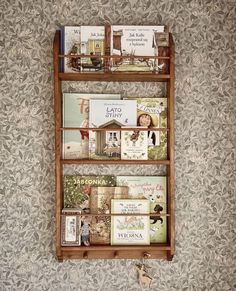 a wooden shelf with books on it against a wall