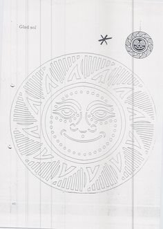 a drawing of a sun face on a piece of paper