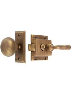 two brass door knobs with handles on each side