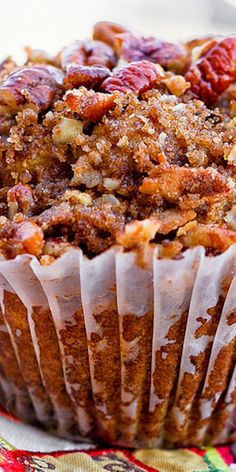 pumpkin pecan muffin in a muffin cup on a towel Sweet Potato Pumpkin Muffins, Pumpkin Muffins With Raisins, Pecan Muffins Recipe Brown Sugar, Pumpkin Nut Muffins, Muffin Breakfast Ideas, Pecan Crumble Topping Recipe, Hearty Muffins, Pumpkin Pecan Muffins, Delicious Thanksgiving Desserts