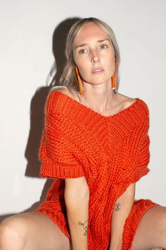 Oversized V-neck sweater vest with a chunky onion knit pattern. Fabric is 100% wool. Ella is 6' tall, 36" bust, 26" waist, 36" hip, and is wearing a size M. Hand Knitted V-neck Sweater For Fall, V-neck Knit Top For Fall, Orange Knit V-neck Top, Slouchy Chunky Knit Top, Wool V-neck Knitted Sweater, Wool Knitted V-neck Top, Chunky Knit V-neck Top For Fall, V-neck Wool Knitted Tops, Knitted Wool V-neck Tops