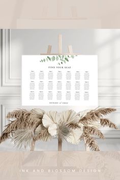 a wedding seating chart with palm trees on it