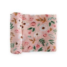 the pink floral pocket square is folded on top of it's side, with leaves and flowers all over it