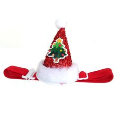 a red and white santa hat with a christmas tree on the top, sitting in front of a white background