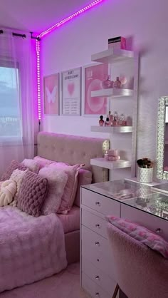 a bedroom with pink lighting and white furniture