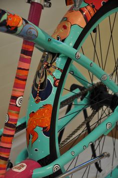 the front wheel of a colorful bicycle