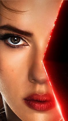 the poster for star wars the last jedi features a woman's face with red lights