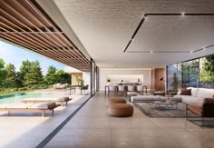 a living room filled with furniture next to a swimming pool