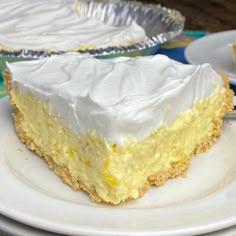 a piece of cake sitting on top of a white plate next to a pie tin