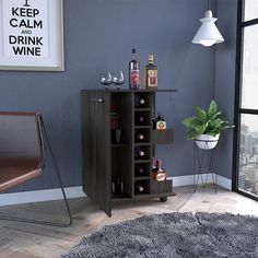 a room with a chair, table and wine rack in the corner next to a window